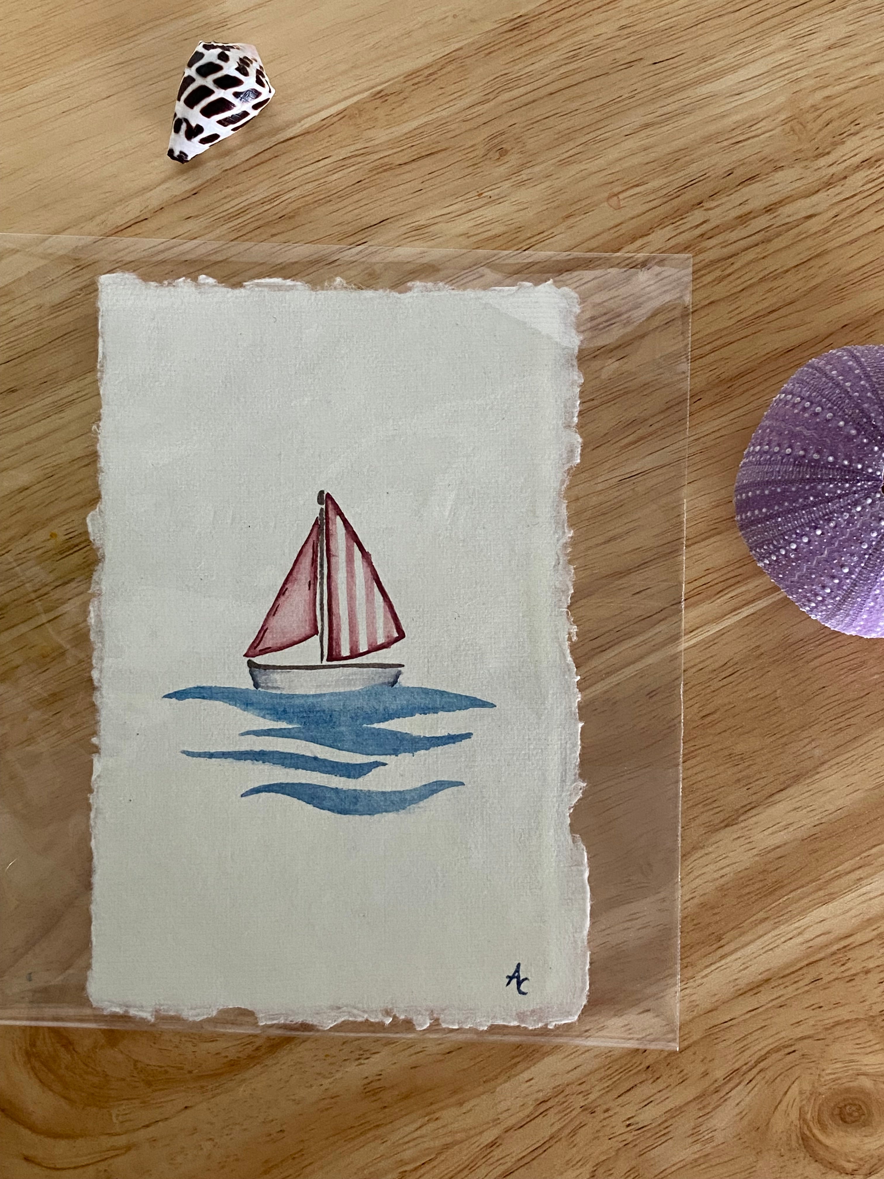 little red sail boat